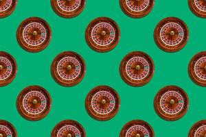Seamless pattern of game table roulette from elite casino on green background photo