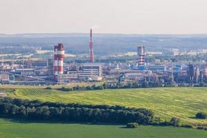 aerial view on pipes of chemical enterprise plant. Air pollution concept. Industrial landscape environmental pollution waste of thermal power plant photo