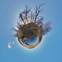 Little planet.  Spherical aerial view  in forest near river in nice day with nice clouds photo