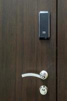 wooden door with electronic combination lock photo