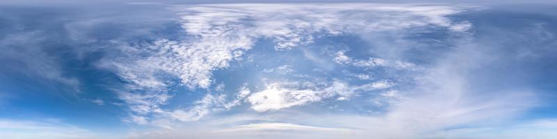 blue sky with beautiful fluffy cumulus clouds. Seamless hdri panorama 360 degrees angle view without ground for use in 3d graphics or game development as sky dome or edit drone shot photo