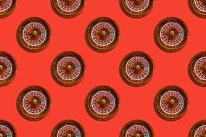 Seamless pattern of game table roulette from elite casino on red background photo