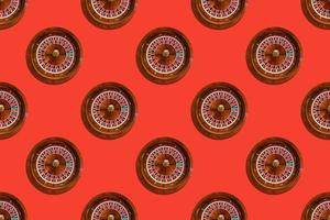 Seamless pattern of game table roulette from elite casino on red background photo