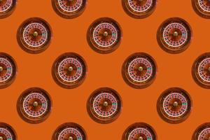 Seamless pattern of game table roulette from elite casino on orange background photo