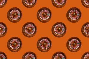 Seamless pattern of game table roulette from elite casino on orange background photo