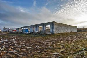 abandoned unfinished garages without a roof with slush and swamp place of gathering stalkers photo