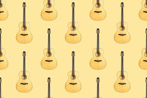 Seamless pattern of wood texture of lower deck of six strings acoustic guitar on yellow background photo