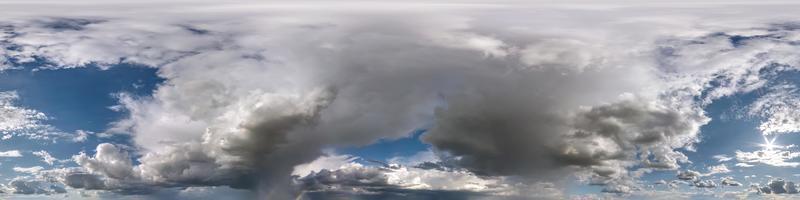 blue sky with beautiful fluffy cumulus clouds. Seamless hdri panorama 360 degrees angle view without ground for use in 3d graphics or game development as sky dome or edit drone shot photo