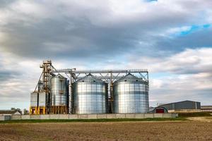 agro-processing and manufacturing plant for processing and silver silos for drying cleaning and storage of agricultural products, flour, cereals and grain. Granary elevator photo