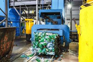 Separate garbage collection. Equipment for pressing debris sorting material to be processed in a modern waste recycling plant. photo