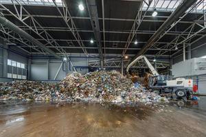 Plastic bales at the waste processing plant. Separate garbage collection. Recycling and storage of waste for further disposal. Business for sorting and processing of waste. photo