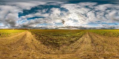 full seamless spherical hdri panorama 360 degrees angle view among fields in autumn sunny day with awesome clouds in equirectangular projection with zenith and nadir, ready for VR AR virtual reality photo