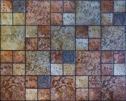 floor stone tiles in various colors and forms. Pattern decoration texture background for loft interior or exterior photo