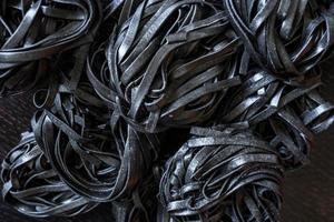 black pasta with cuttlefish ink. Pasta of durum wheat semolina with squid ink photo