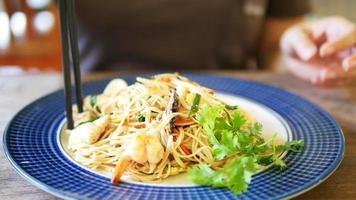 Close up of woman eating asian food - asian food eating concept video