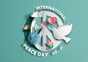 Sign and symbols with the day and name of International Peace Day in paper cut style on green paper pattern background. vector