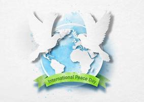 Doves peace with a global and ribbon banner in paper cut and watercolors style with International Peace Day lettering on white paper pattern background. vector