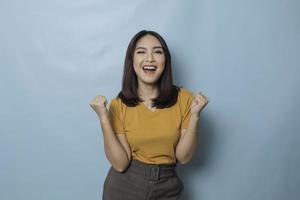 A young Asian woman with a happy successful expression photo