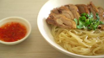 dried noodles with stewed duck in white bowl - Asian food style video