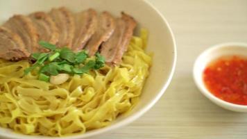 dried noodles with stewed duck in white bowl - Asian food style video