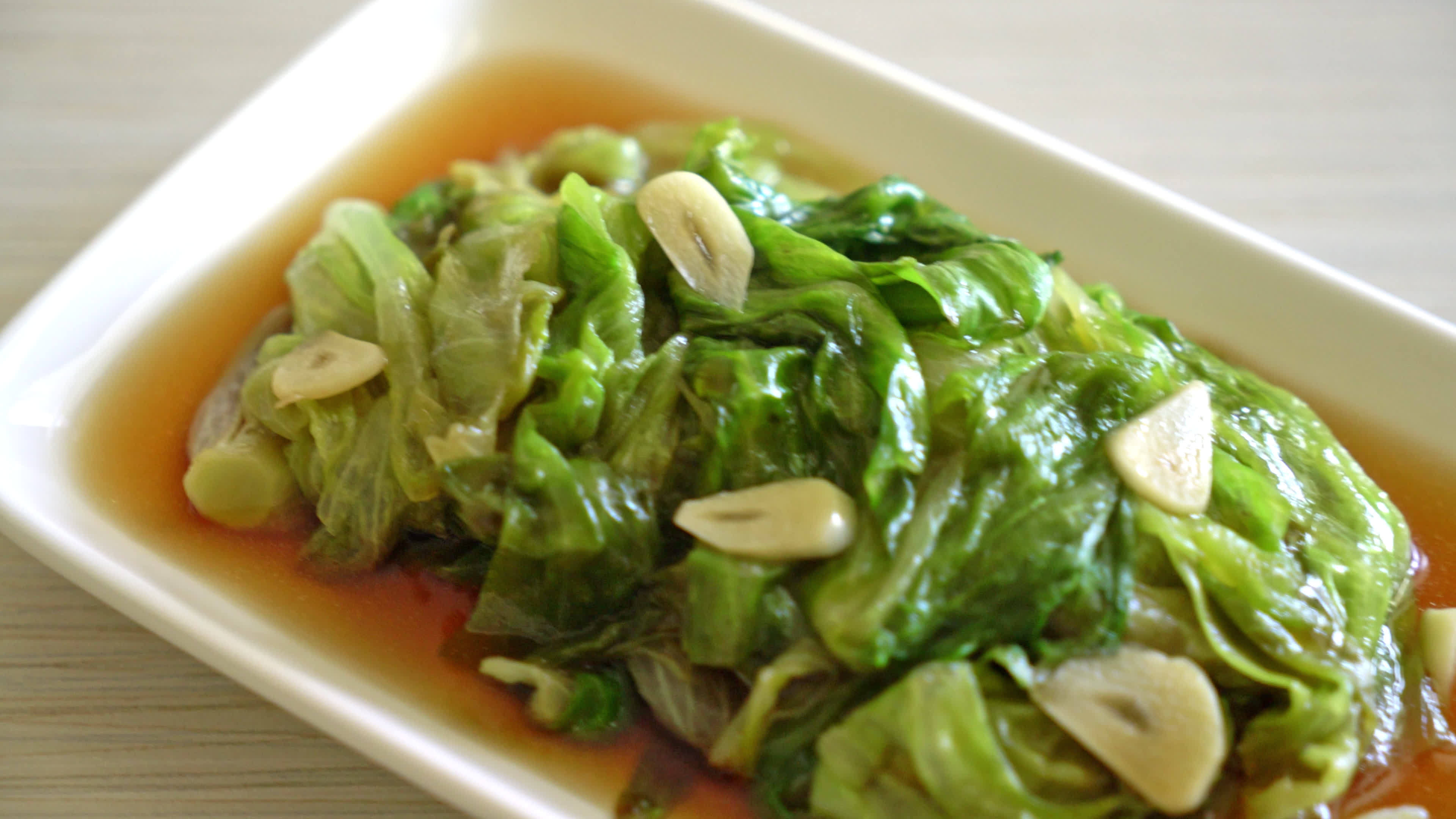 Stir fried Iceberg lettuce with Oyster sauce Healthy food style 9835871 Stock Video at Vecteezy