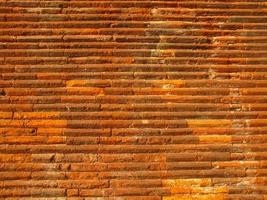 industrial style Ancient Roman red brick wall background photo