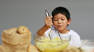 Boy making mashed potato video