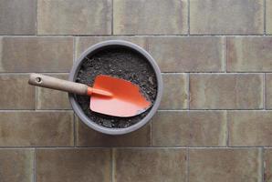 garden spade and earth bucket for potted plant