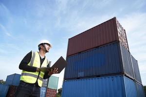 Foreman controls the loading of containers from cargo ships for import and export,Foreman or Supervisor in Container Terminal. photo