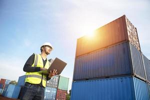 Foreman controls the loading of containers from cargo ships for import and export,Foreman or Supervisor in Container Terminal. photo