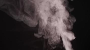 White smoke, fog, mist, vapor on a black background. video