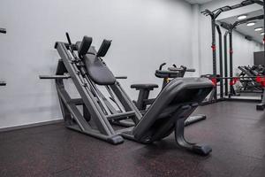 Modern light gym. Sports equipment in gym. photo