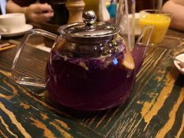 Glass teapot with karkade tea photo