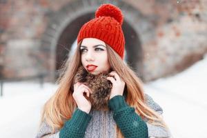 Close-up portrait of a beautiful girl in winter fashionable clothes photo