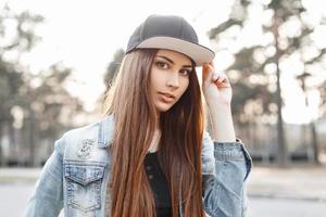 Close-up portrait of a young stylish woman on a sunny day photo