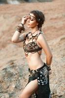 Fashion Beauty and stylish girls. Spirituality dance. Beautiful Sexy Woman With Luxury glossy gold eastern Makeup danceing tribal fusion. Indian accessories photo
