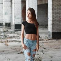 Beautiful portrait of a pretty woman on the ruins of the bricks photo