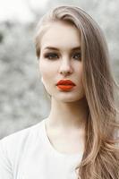 Spring portrait of a pretty woman with red lips. photo