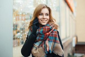 Pretty woman with a sweet smile makes the Christmas shopping photo