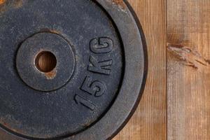Close-up of weight for the bench on a wooden background photo