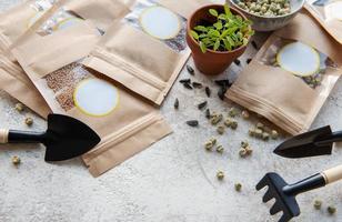 Microgreen seeds in paper bags and equipment for sowing microgreens. photo