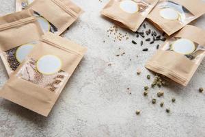 Microgreen seeds in paper bags and equipment for sowing microgreens. photo