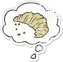 cartoon croissant and thought bubble as a distressed worn sticker vector