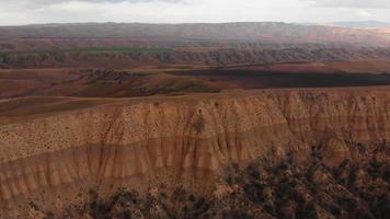 Static aerial view of colorful land with 4wd car standing on wilderness. Exploring vashlovani national park video