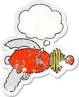 cartoon ray gun and thought bubble as a distressed worn sticker vector