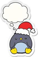 lindo pingüino de dibujos animados con sombrero de navidad y burbuja de pensamiento como pegatina impresa vector