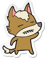 sticker of a cartoon wolf waving showing teeth vector