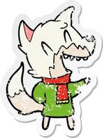 distressed sticker of a laughing fox wearing winter clothes vector