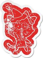 cartoon distressed sticker of a cat wearing santa hat vector