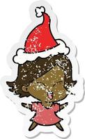 happy distressed sticker cartoon of a girl wearing santa hat vector